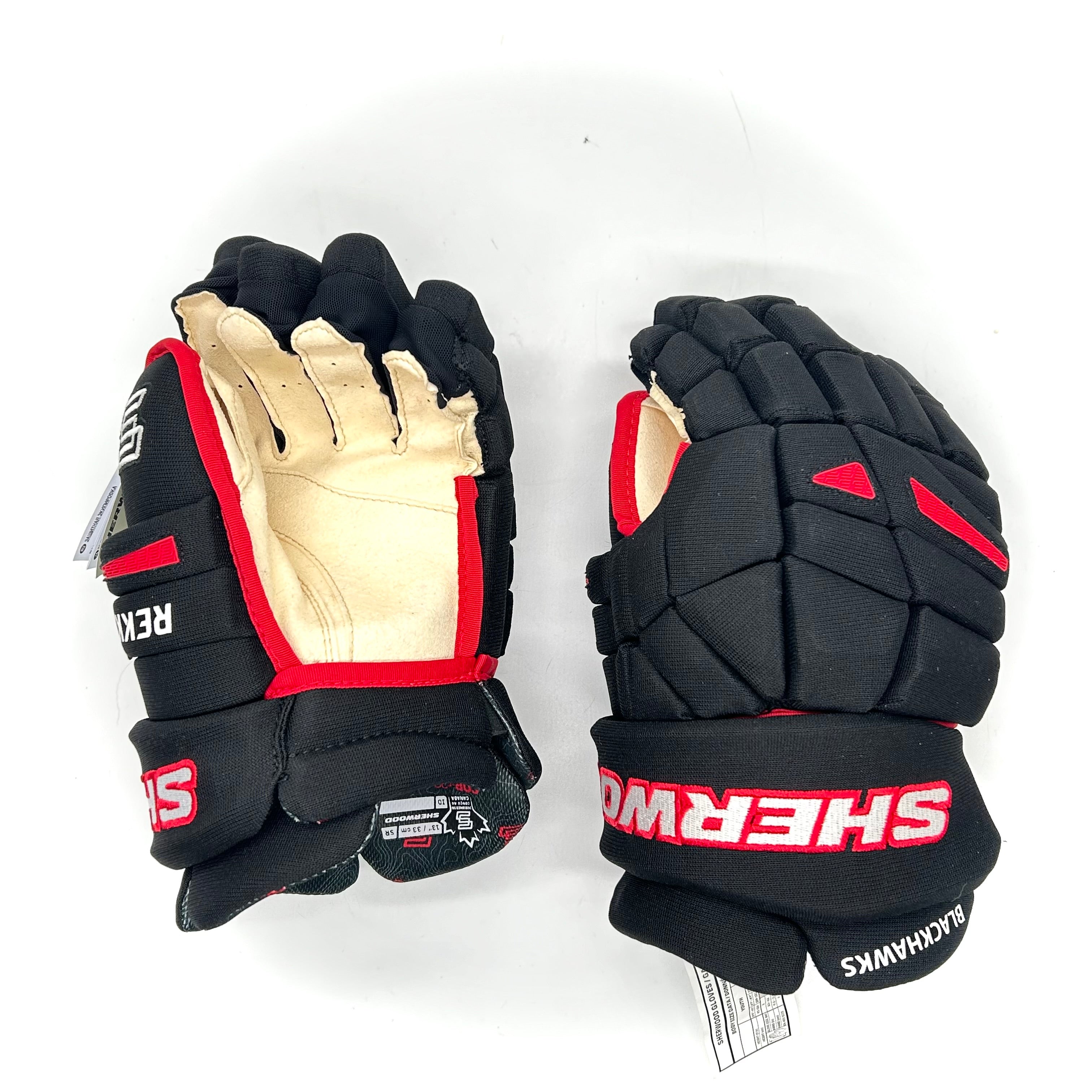 Gant Sherwood Rekker Legend Pro – NHL Pro Stock – Paume Pro – Blackhawks de Chicago (noir/rouge)
